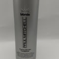 Large bottle of Paul Mitchell Forever Blonde Conditioner for professional hair repair.