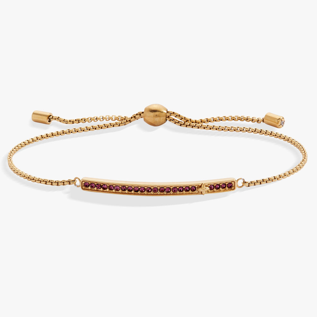 February birthstone bolo bracelet with a purple amethyst-colored stone and gold-tone finish.