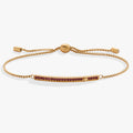 February birthstone bolo bracelet with a purple amethyst-colored stone and gold-tone finish.