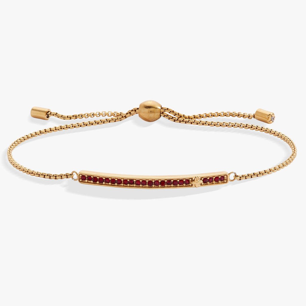 January birthstone bolo bracelet featuring a bold siam red stone with pave accents.
