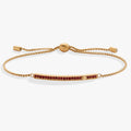 January birthstone bolo bracelet featuring a bold siam red stone with pave accents.