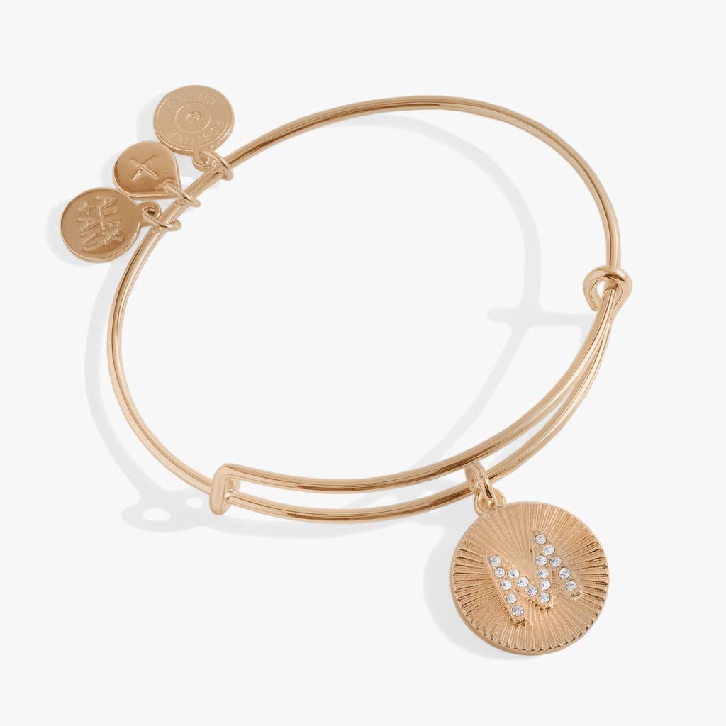 Elegant Initial M bangle featuring a pavé crystal letter and textured circle charm.