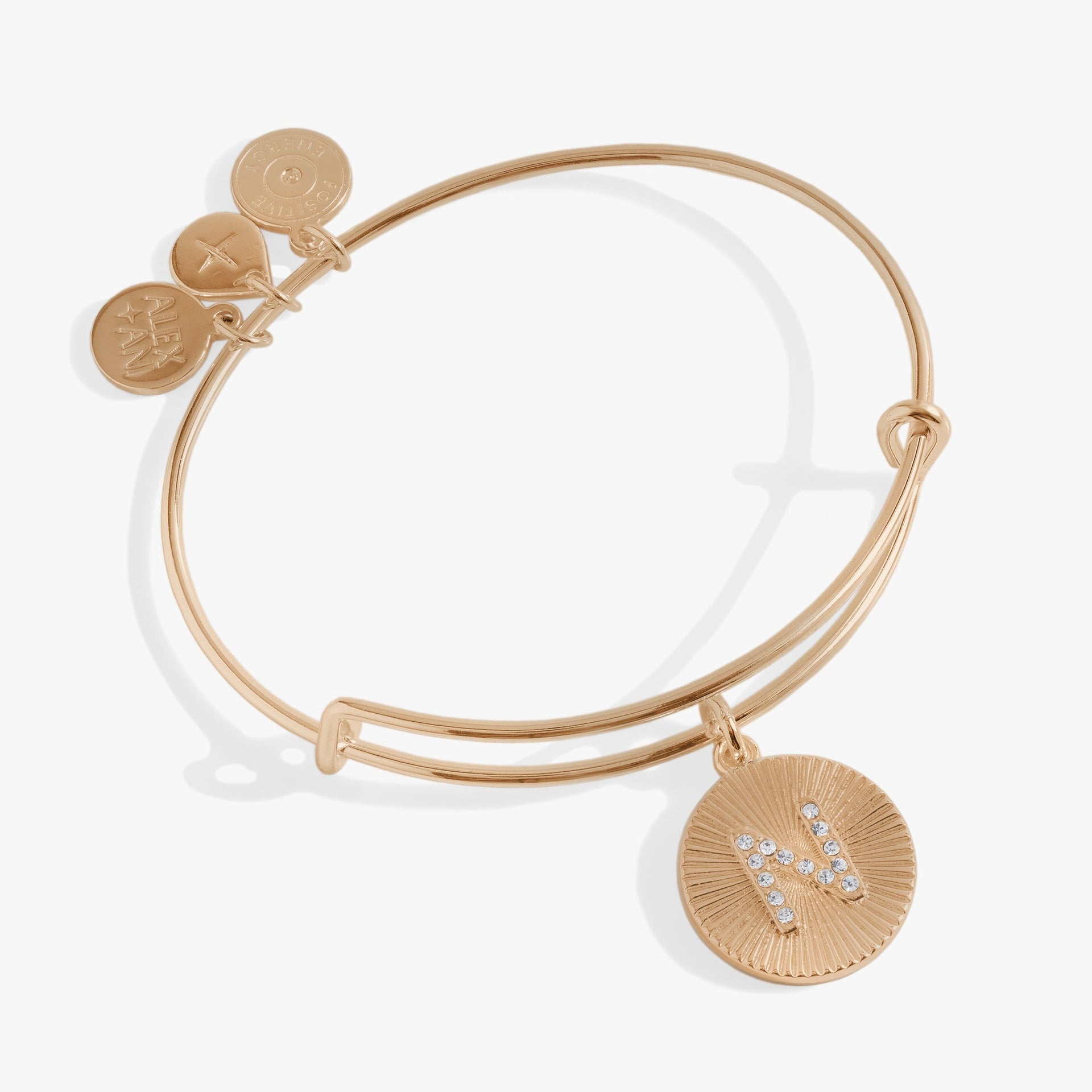 Gold and silver starburst texture bangle featuring the letter N in pavé crystals