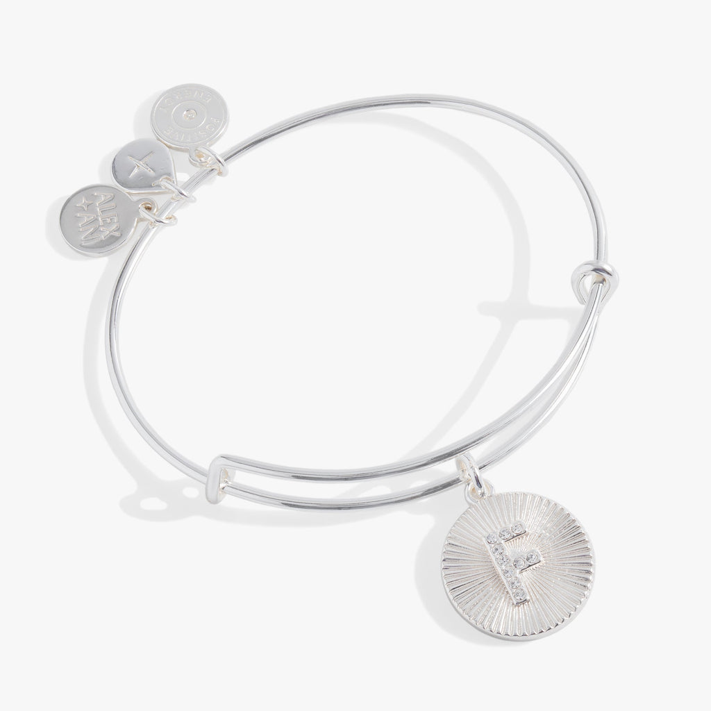 Silver and gold starburst texture bangle with a pavé crystal letter F