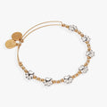 Two-tone expandable wire bangle featuring paw print charms and decorative beads.