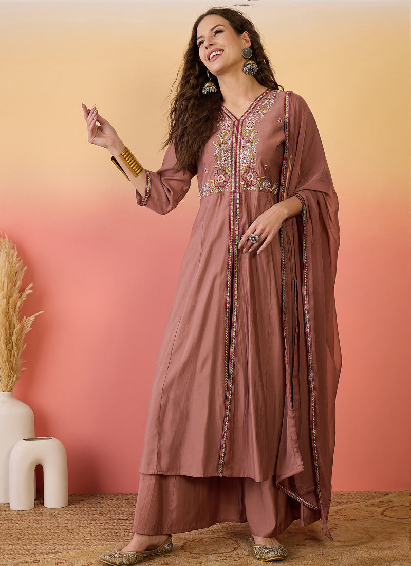 Woman wearing a brown A-line Roman Silk kurta with matching palazzo pants and embroidered details.