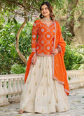 Orange Chinon Silk lehenga style suit with intricate embroidery and matching dupatta