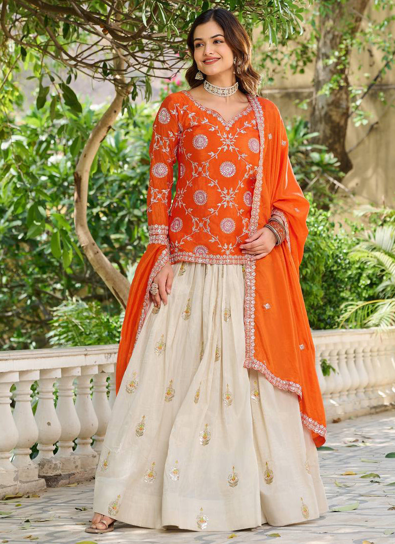 Orange Chinon Silk lehenga style suit with intricate embroidery and matching dupatta