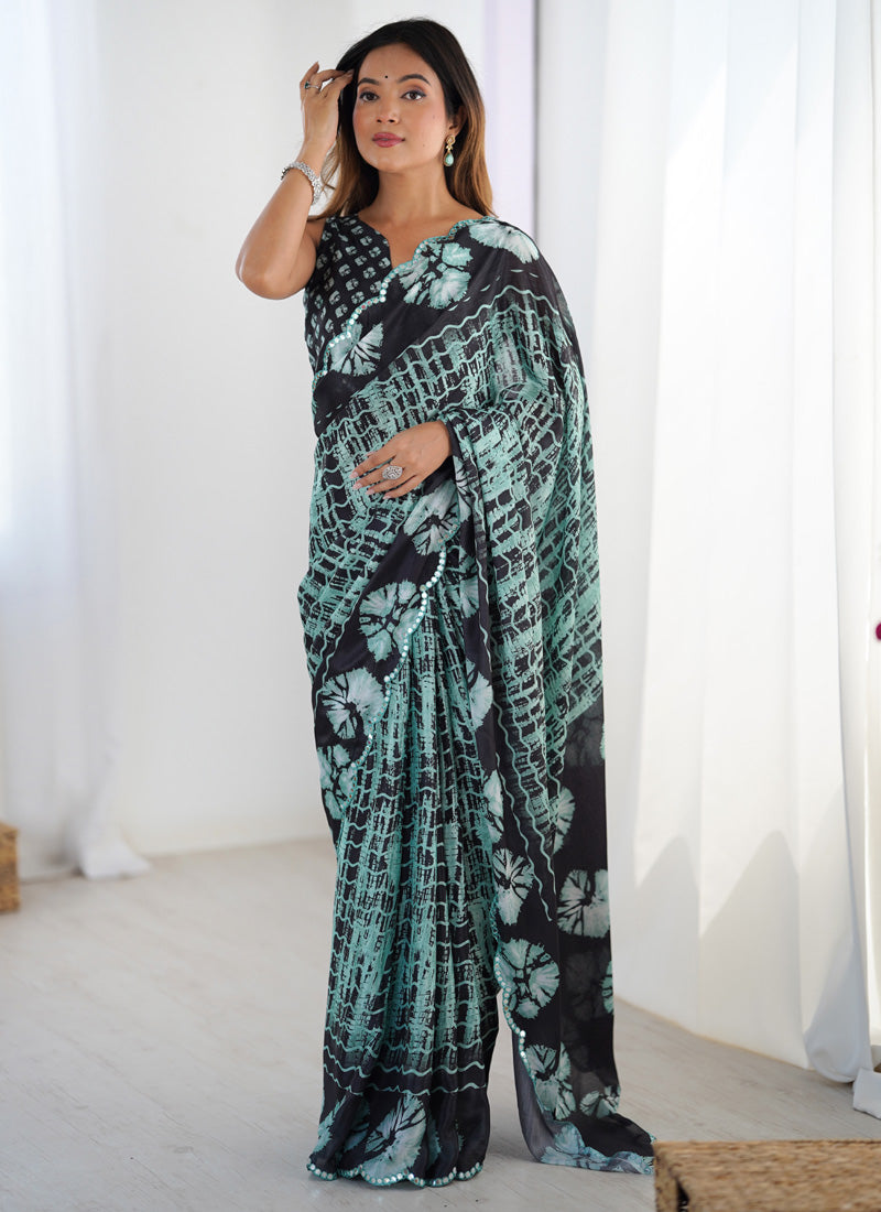 Vibrant multi-colored printed party wear saree made from Chinon fabric