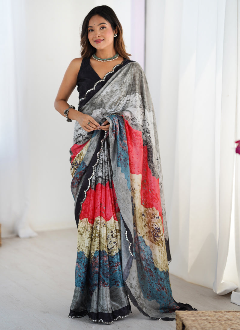 Woman wearing a multi-color abstract print chinon saree with a modern glamorous aesthetic