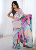 Close-up view of the multi-colored print on a premium Chinon saree