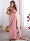 A beautiful baby pink organza saree with Gota Patti work for toddlers, including a maroon unstitched blouse piece.