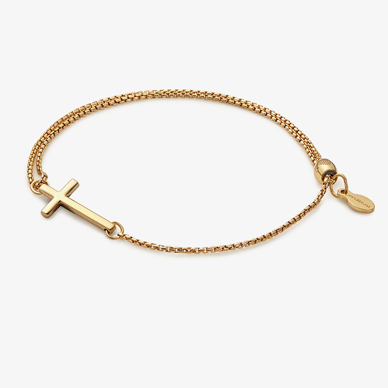 Delicate pull chain bracelet with a petite cross charm in gold and silver