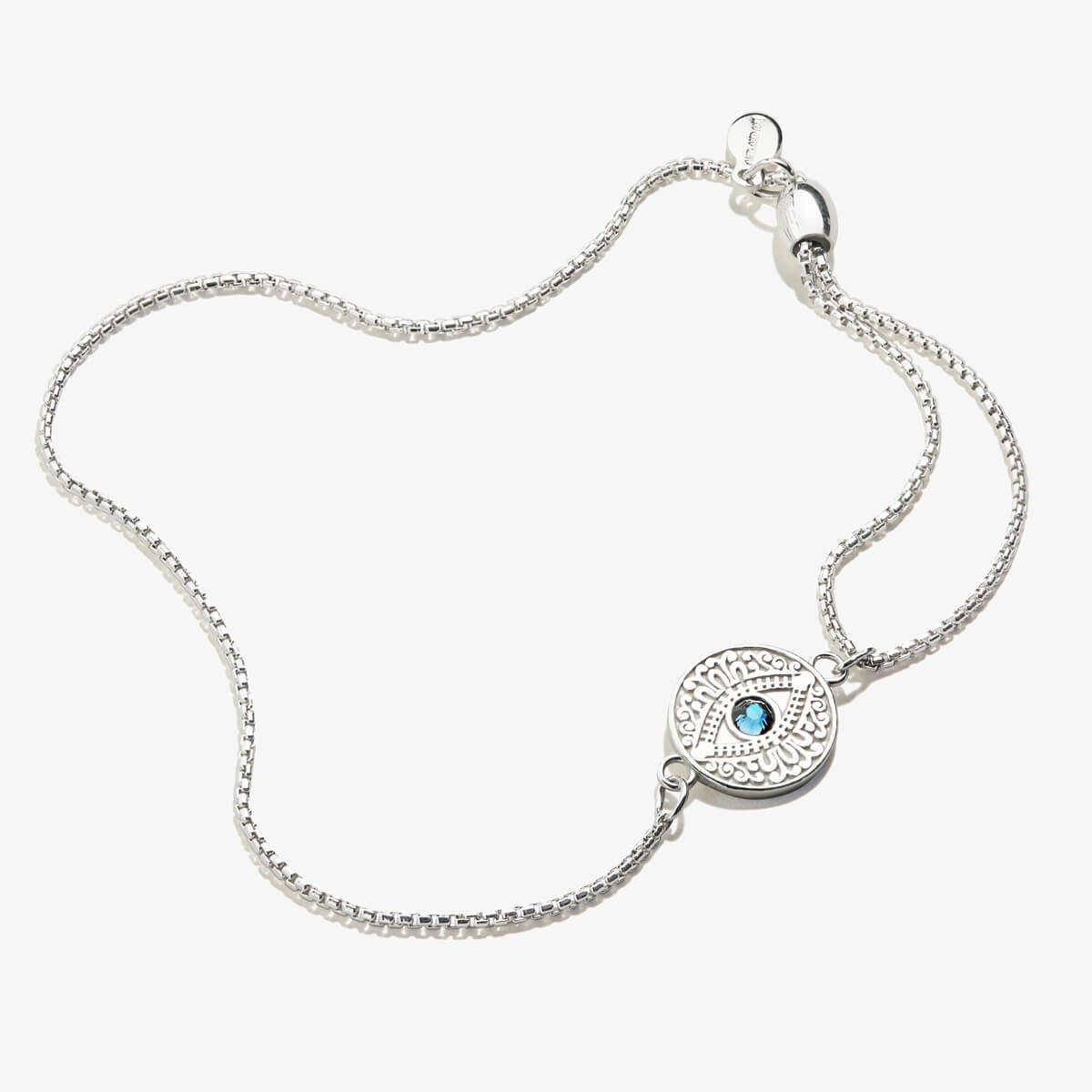 Close up of an evil eye charm bracelet with clear crystals on an adjustable pull chain.