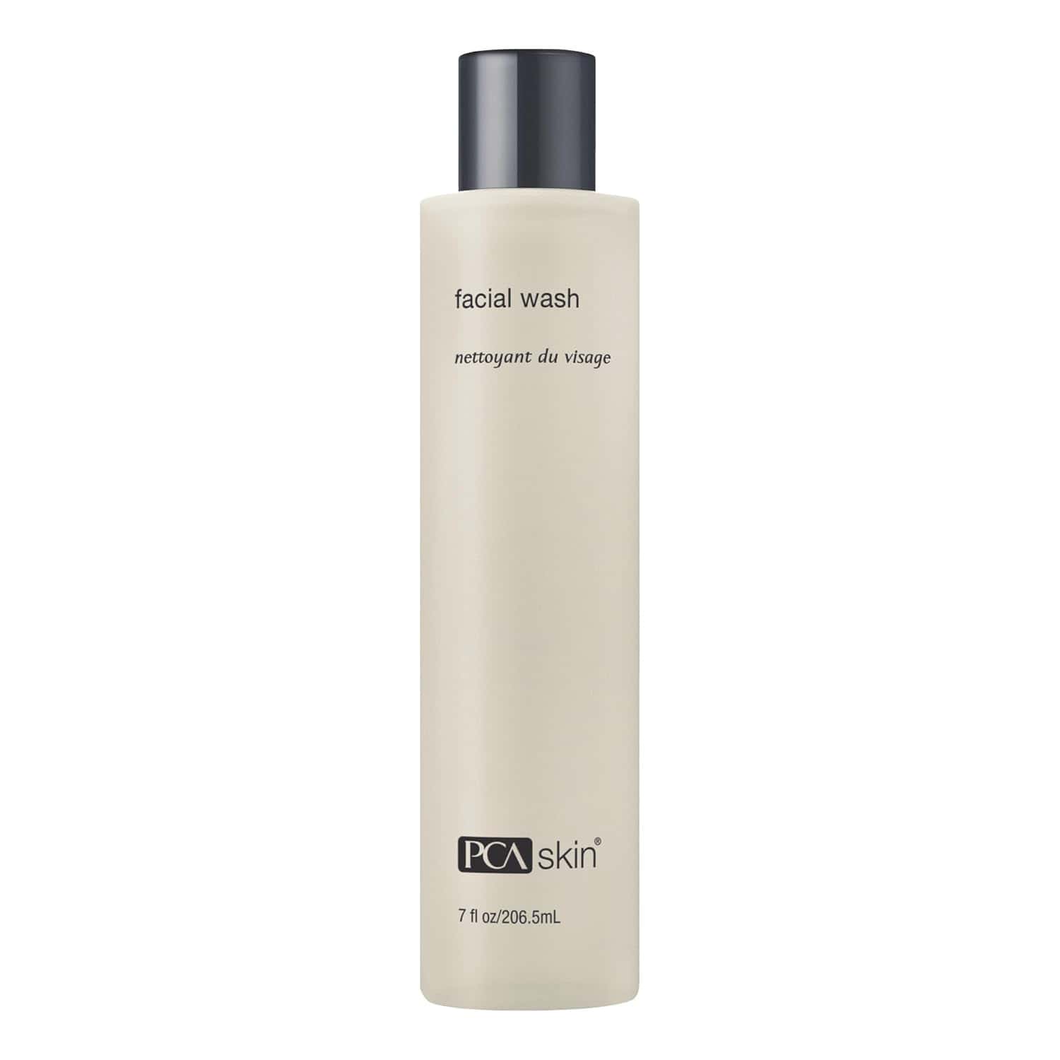 Neutral beige bottle of PCA Skin facial wash with black text branding.
