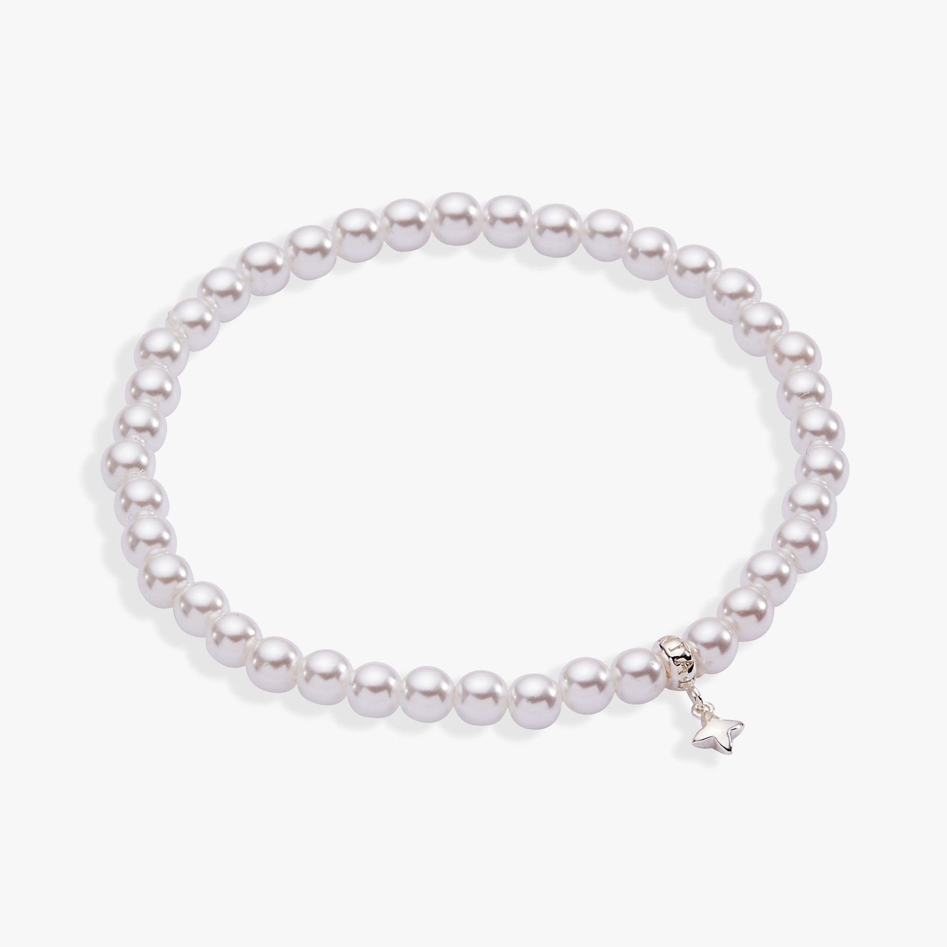 White pearl beaded stretch bracelet with a silver star charm on a neutral background.