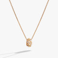 Pearl and crystal pendant necklace featuring an etched starburst design on an adjustable silver-tone chain.