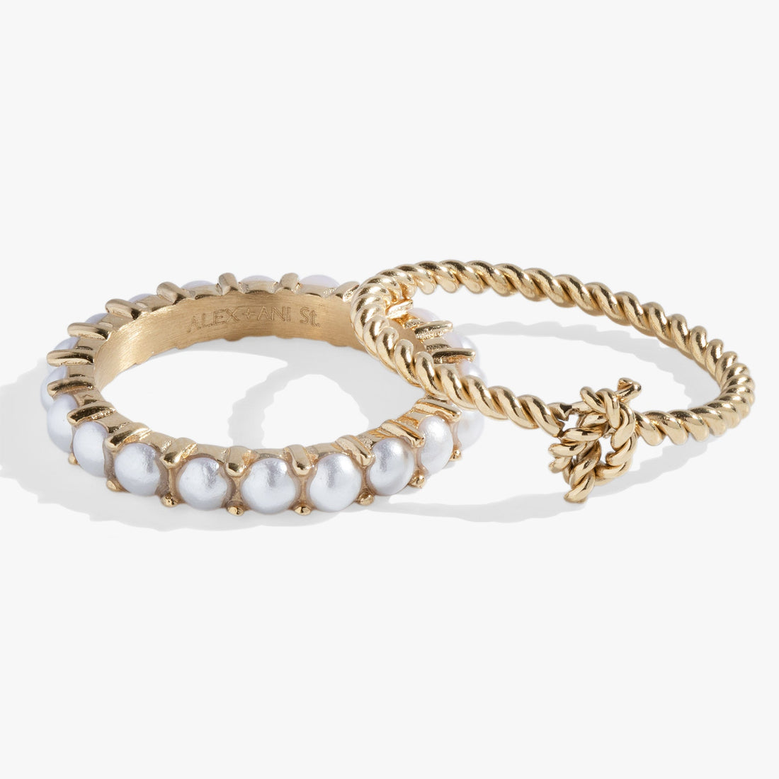 Set of two gold-tone rings: one pearl infinity band and one rope design knot band on a white background.