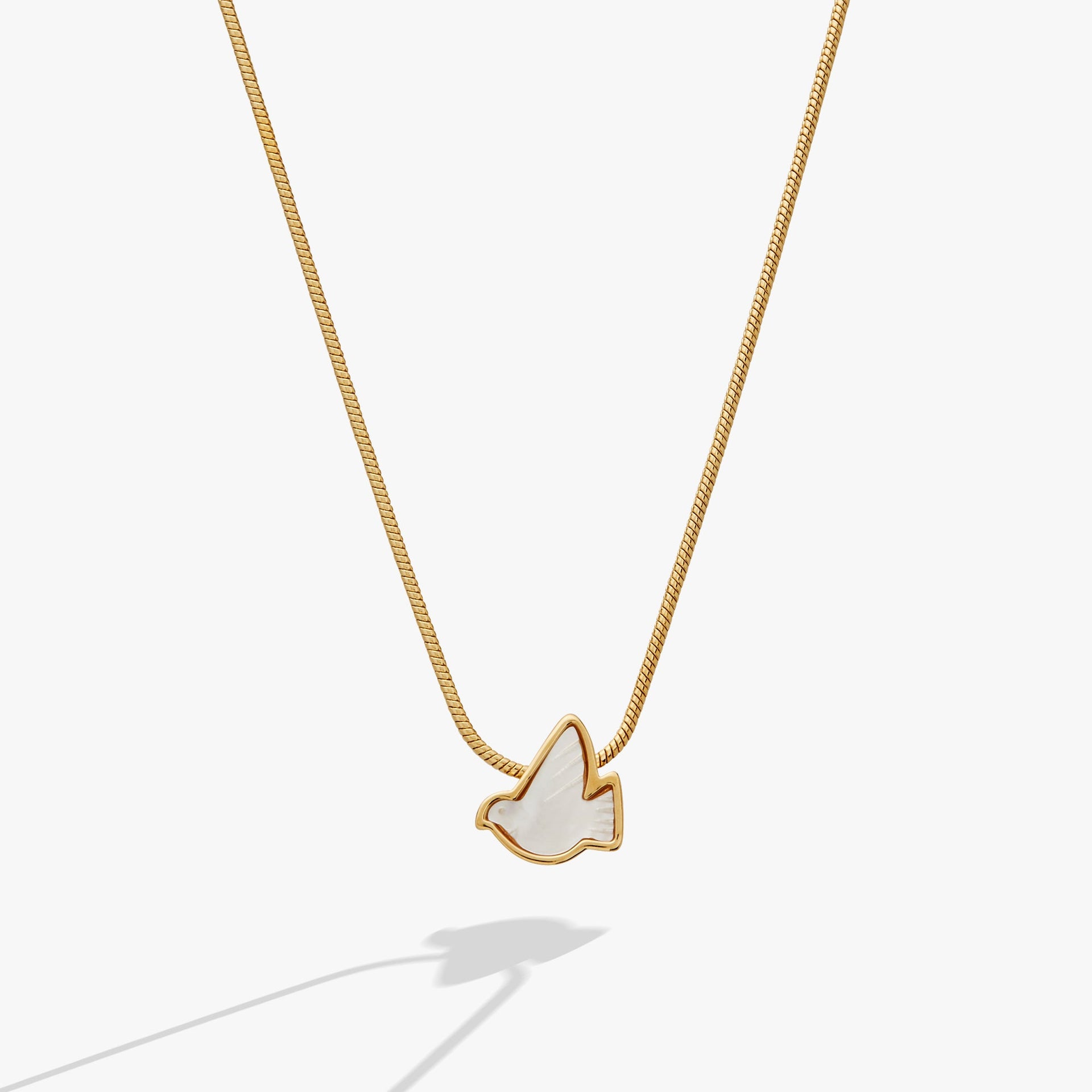 Pearlized dove pendant slider necklace with gold plating and mother of pearl inlay