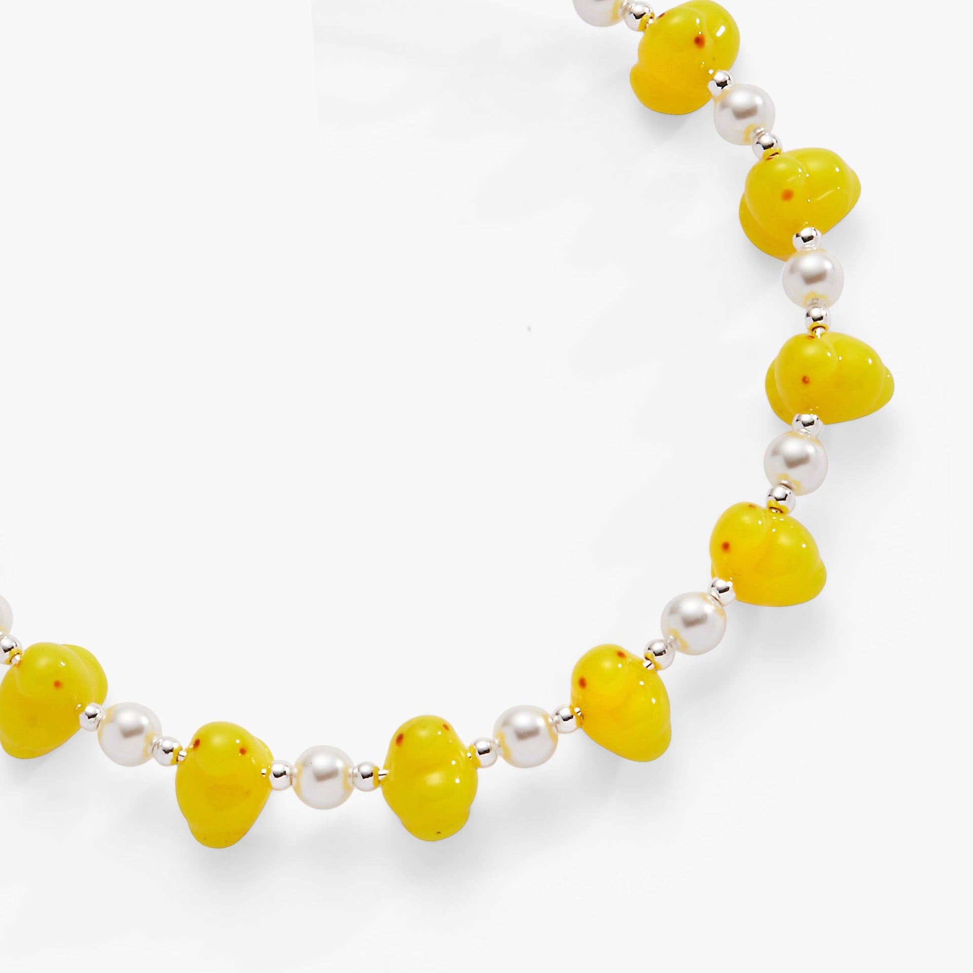 Expandable wire bangle featuring yellow enamel PEEPS® chick beads, pearl crystals, and silver-tone accents.