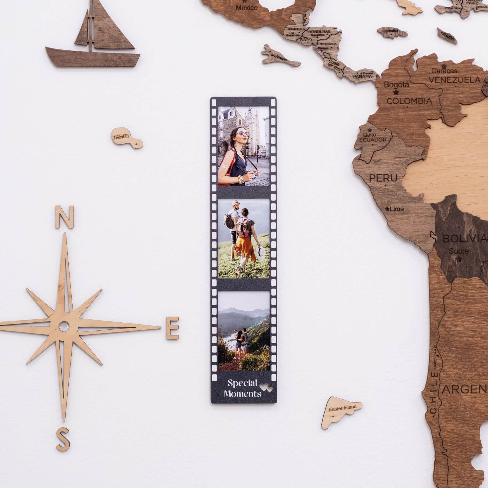 A 3-in-1 wooden collage photo frame displayed on a wall for travel memory decor.