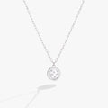 Double-sided Pisces zodiac pendant necklace with crystal accents on a delicate chain