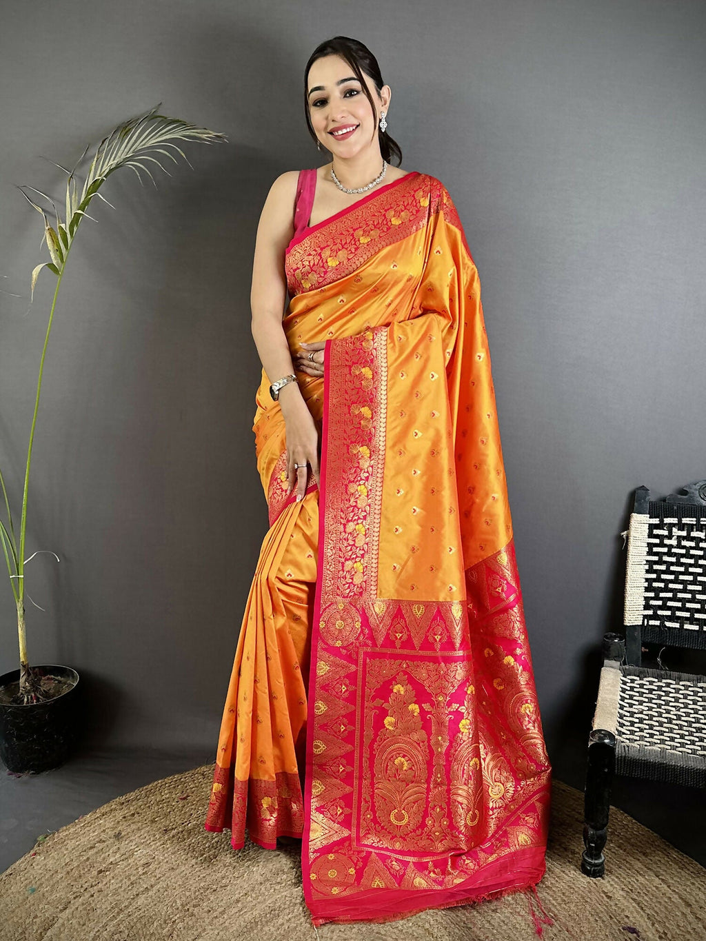 Vibrant orange soft silk Banarasi saree with detailed intricate motifs