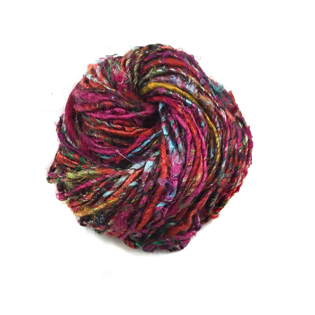 Vibrant multi-colored and red handspun banana fiber yarn in a bohemian style