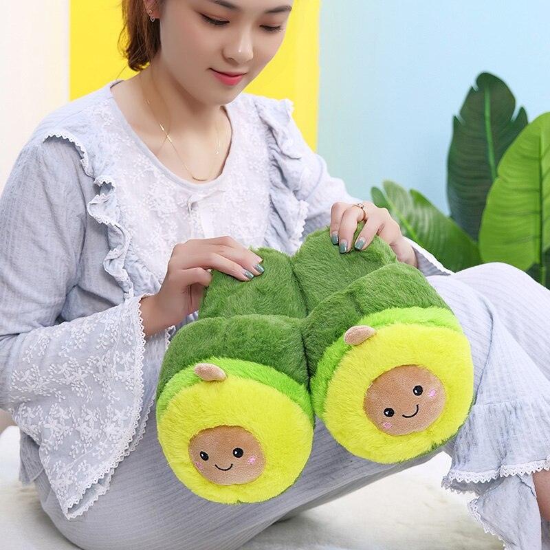 A pair of cute, plush avocado-themed slippers with fuzzy lining, perfect for indoor lounging.