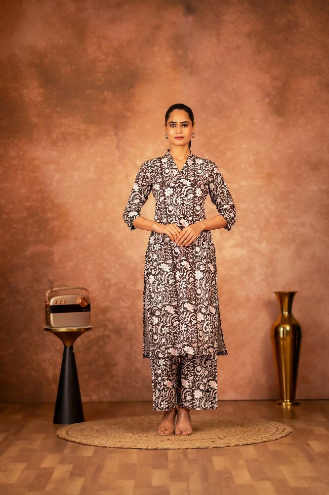 Woman wearing a black floral hand block printed cotton kurta with matching pants
