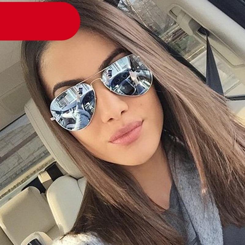 Pair of gold and silver metal polarized sunglasses with mirror-finish lenses