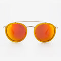 Ponce sunglasses featuring burl wood frames and a gold curved brow bar.
