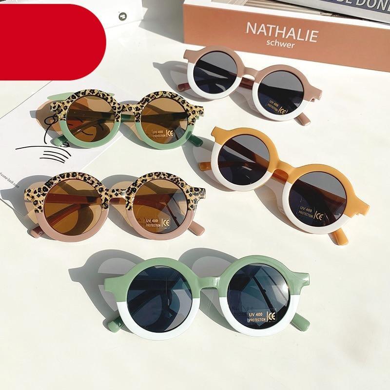 Leopard print kids sunglasses with cartoon bear design and black hard case