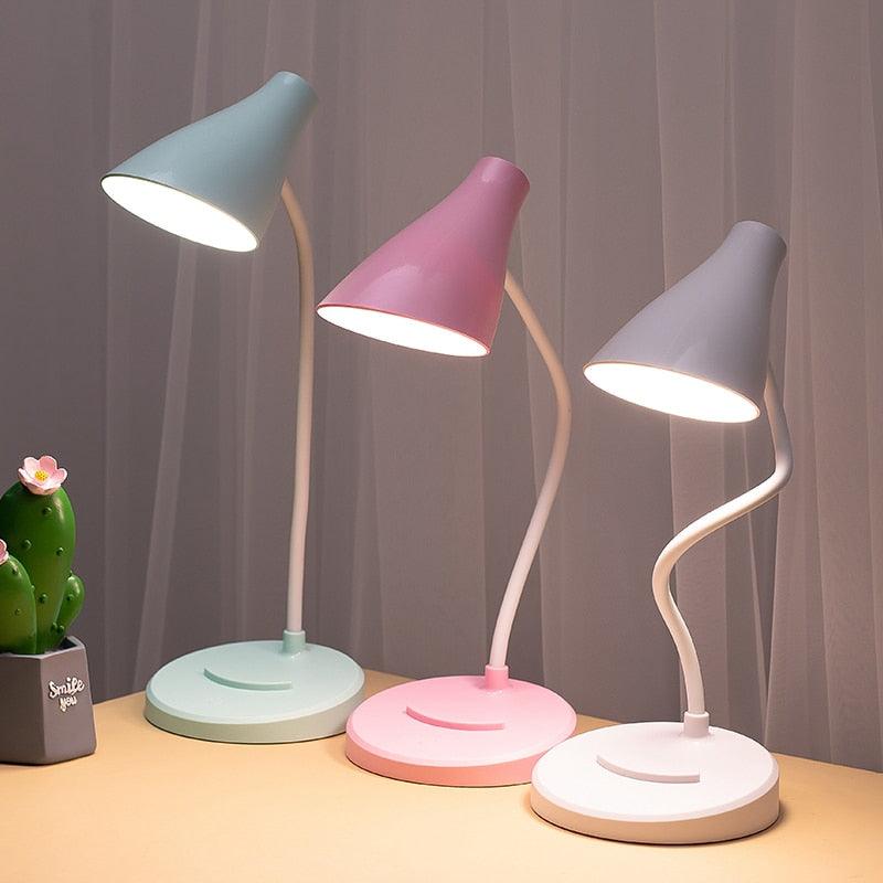 Portable white foldable LED desk lamp for office or bedside use