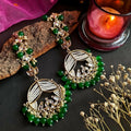 Traditional green Doli Chandbali earrings crafted from brass for ethnic attire.