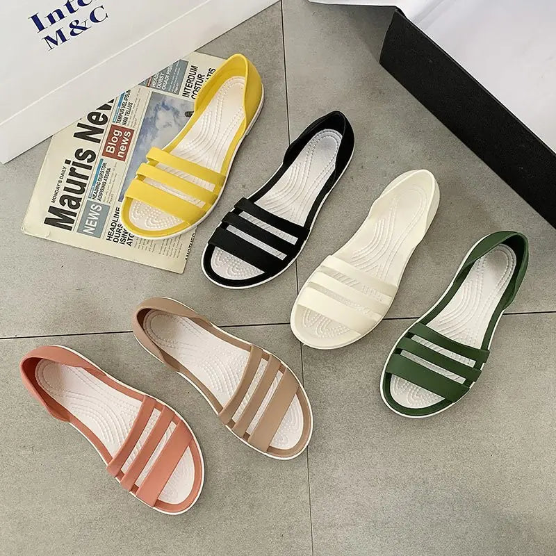 Collection of women's flat sandals in multiple candy colors including yellow, black, white, green, beige, and peach.