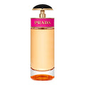 Prada CANDY Eau de Parfum bottle with pink, gold, and amber aesthetic