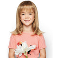 Kid wearing the Pretty in Fabulous mid-length wig with softly flipped layers
