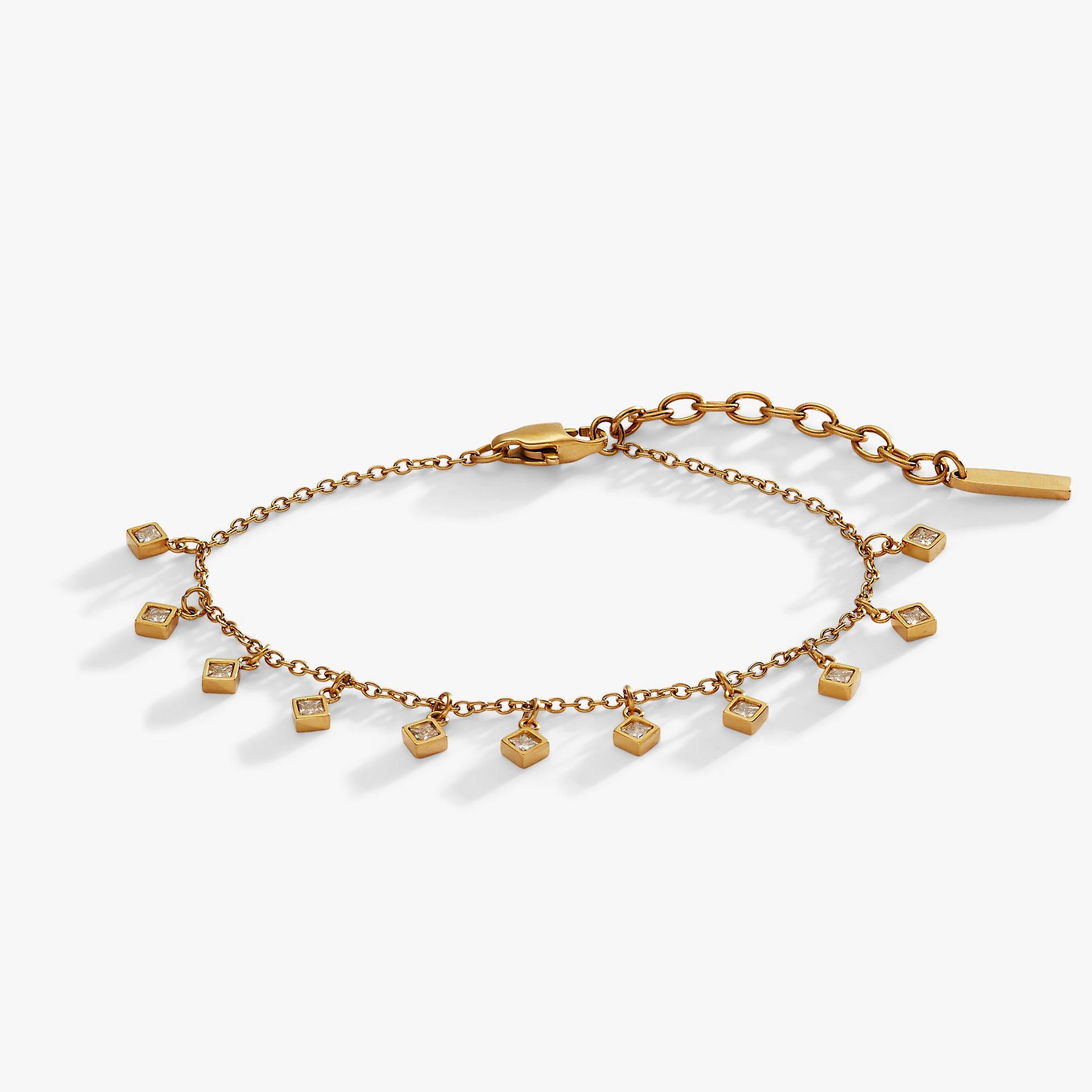 Gold-tone chain bracelet featuring dangling princess-cut crystal charms.