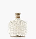John Varvatos Artisan Pure men's fragrance in a white and brown coastal-style bottle.