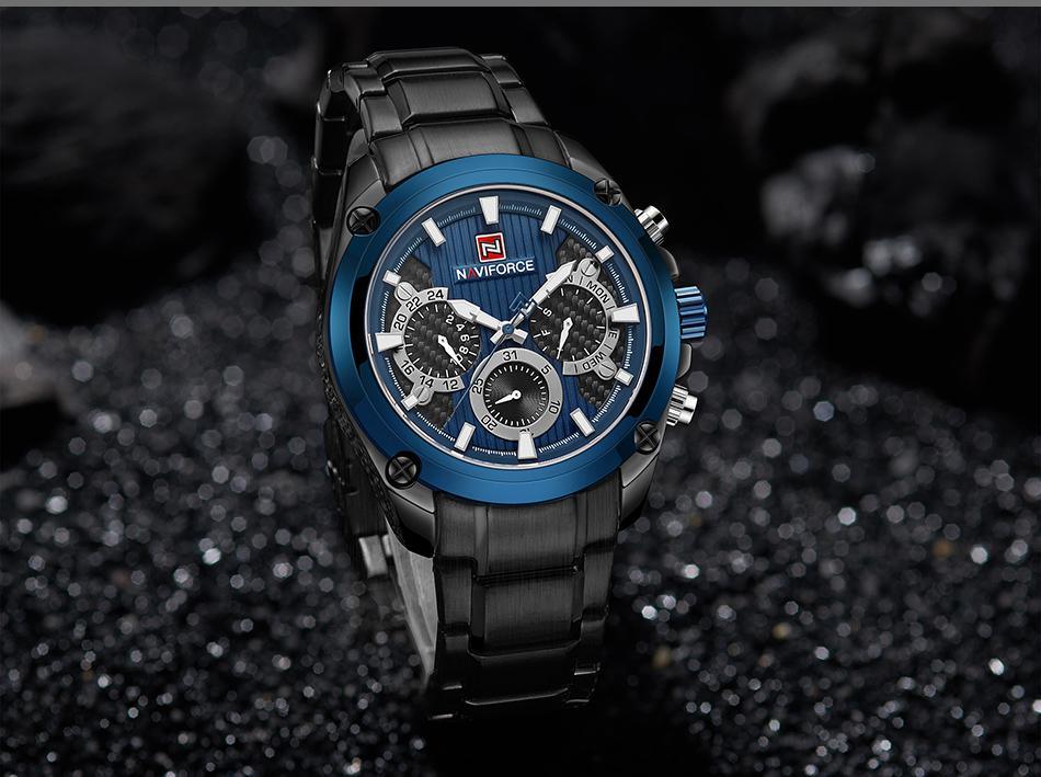 Elegant stainless steel men's business watch with a navy blue face and multifunction chronograph.