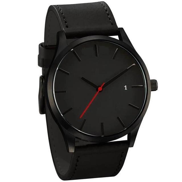 Elegant black men's watch with quilted leather strap and date display on a clean background