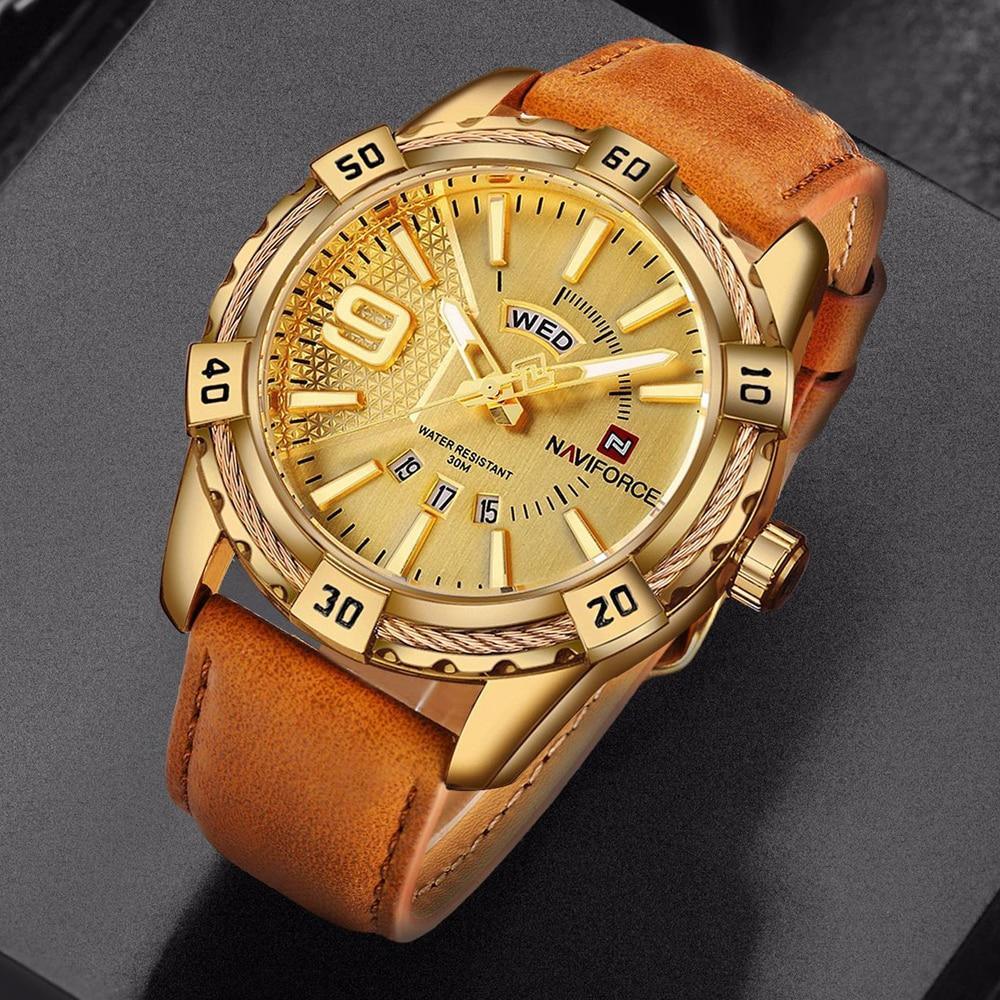 Men's sporty watch with brown leather strap, gold casing, and fluorescent dial hands.