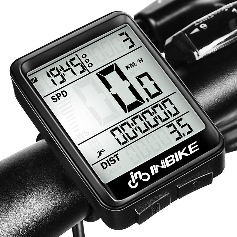 Stevvex wireless bike computer mounted on handlebars displaying speed and distance with LED backlight illuminated
