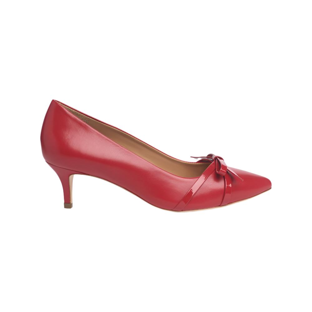 Side view of a red Celine Mestico kitten heel pump with a bow detail on a white background