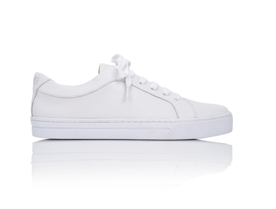 Side profile view of the Equality White Nappa leather fashion sneaker with a clean lace-up design and minimalist aesthetic.