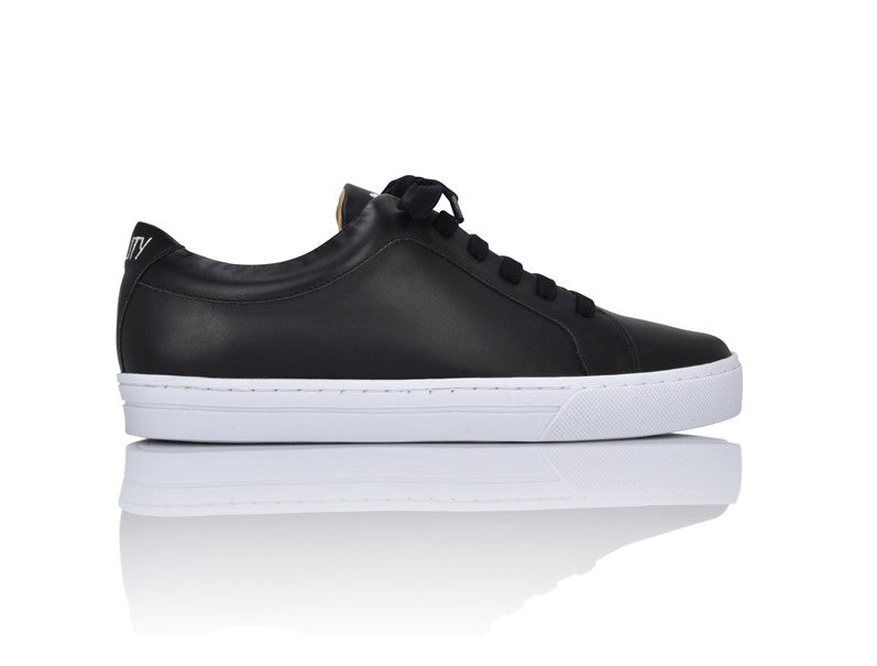 Side profile of a black Equality sneaker in soft Nappa leather with a white rubber sole