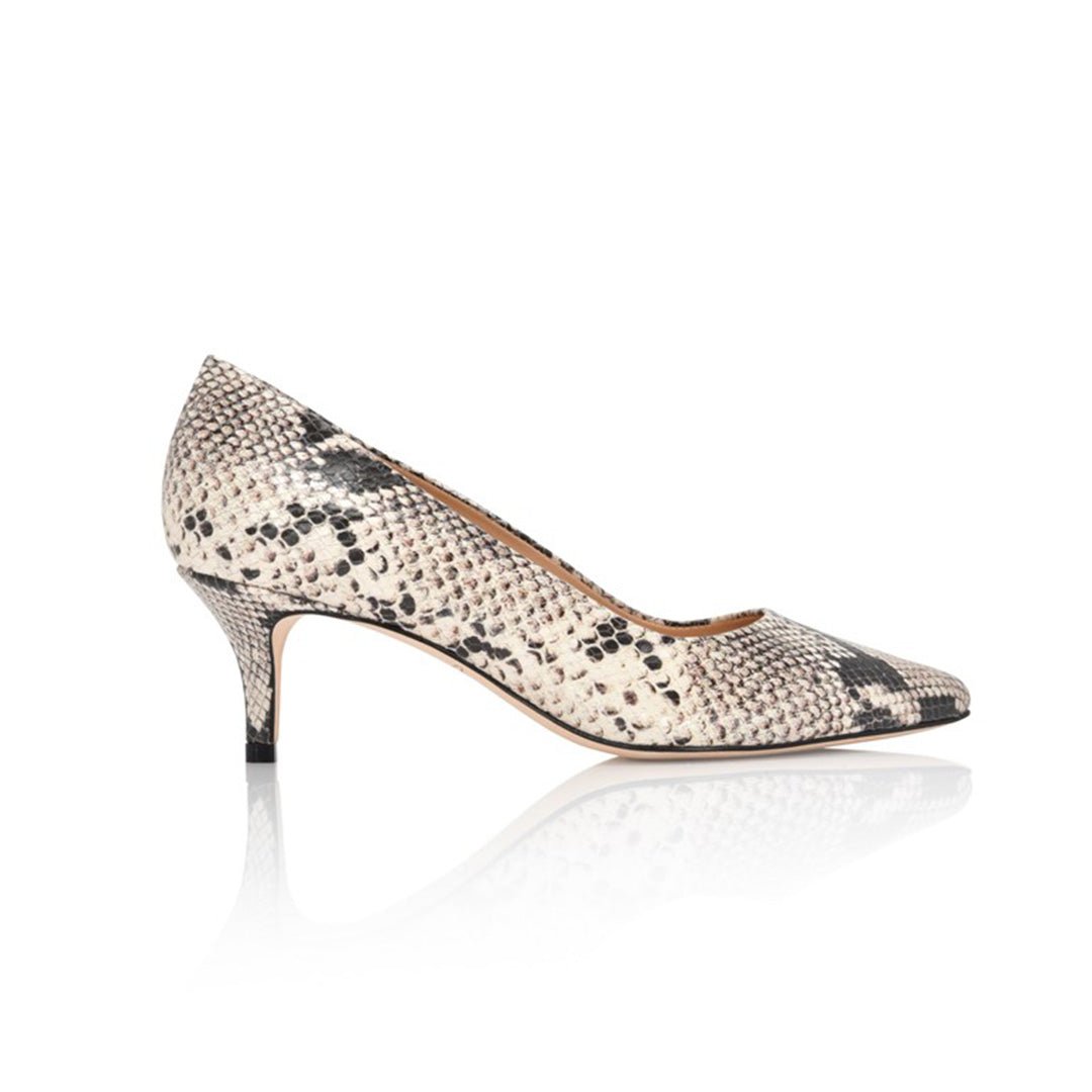 Side profile of a natural snakeskin printed pointed toe kitten heel pump.