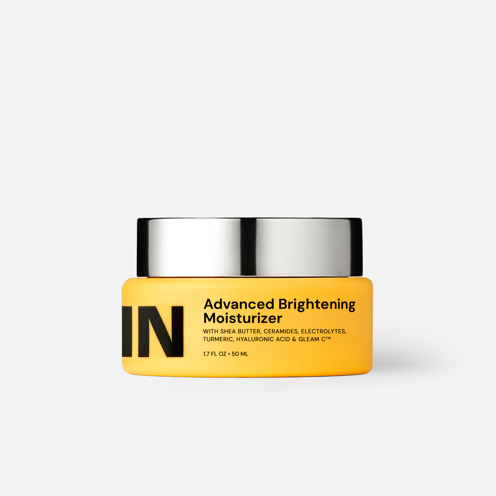 Yellow jar of Advanced Brightening Moisturizer featuring Shea Butter, Ceramides, and Gleam C formula.