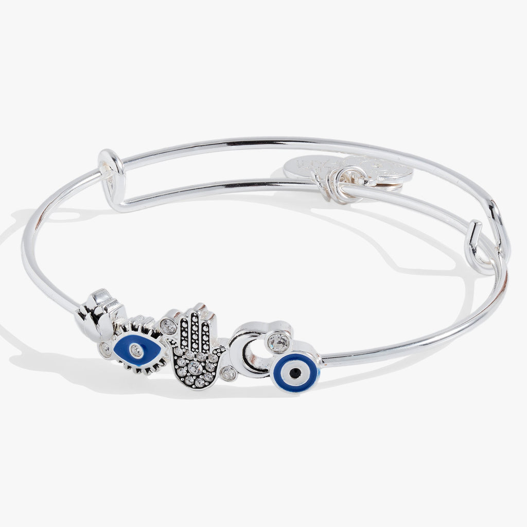 Alex And Ani Protection inline wire bangle featuring a hamsa hand, moon, lotus, and evil eye charms with clear crystals.